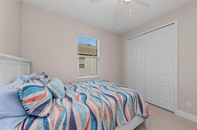 bedroom featuring a ceiling fan, a closet, and baseboards