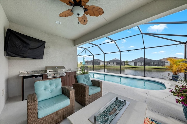 outdoor pool featuring a lanai, a patio area, a water view, and area for grilling