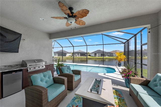 view of patio with an outdoor living space with a fire pit, grilling area, area for grilling, glass enclosure, and an outdoor pool