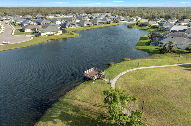 bird's eye view with a residential view and a water view