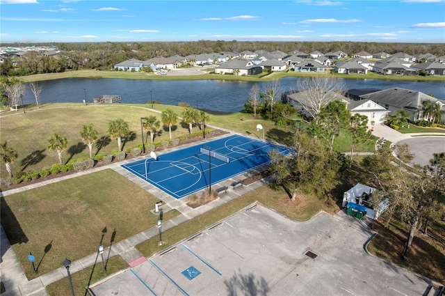 bird's eye view featuring a water view and a residential view