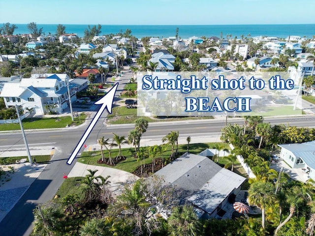 birds eye view of property featuring a residential view and a water view