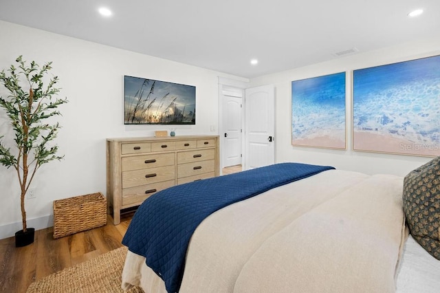 bedroom with recessed lighting, light wood-type flooring, and visible vents