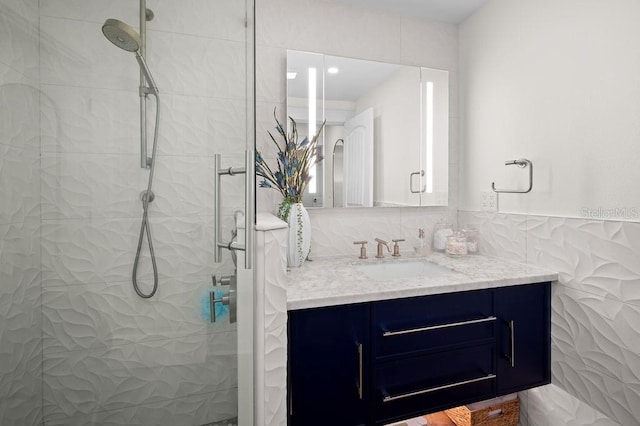 bathroom featuring tasteful backsplash, a stall shower, and vanity