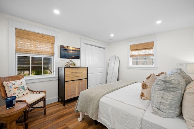 bedroom featuring recessed lighting, a closet, and wood finished floors