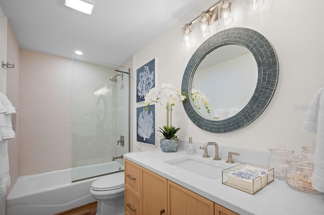 bathroom with vanity, shower / bathing tub combination, and toilet