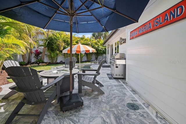 view of patio featuring outdoor dining area and fence