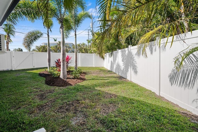 view of yard with a gate and a fenced backyard