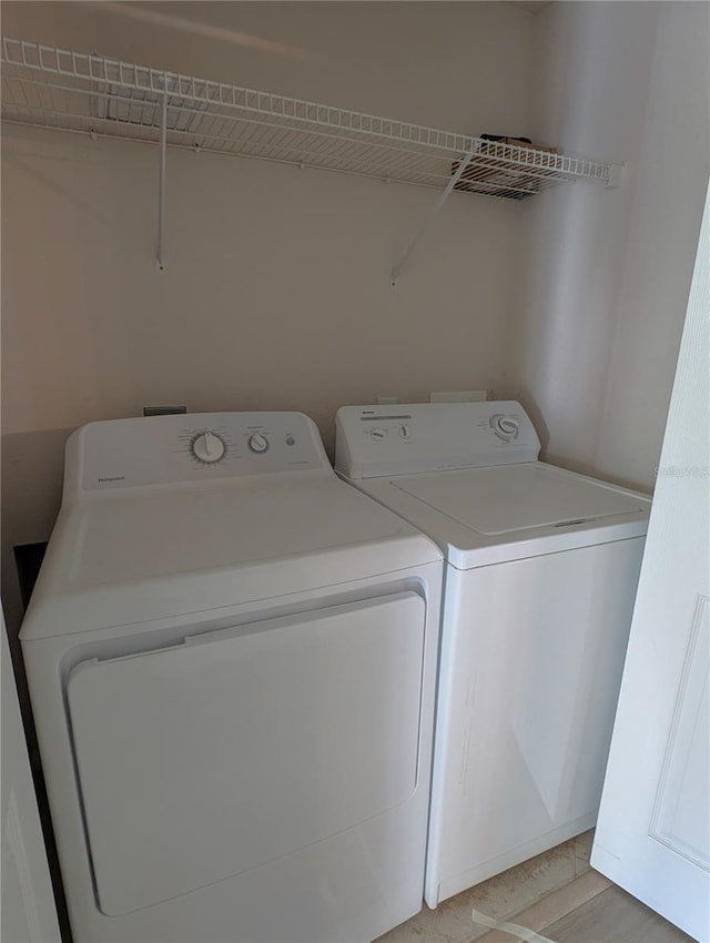 washroom with laundry area and washing machine and clothes dryer