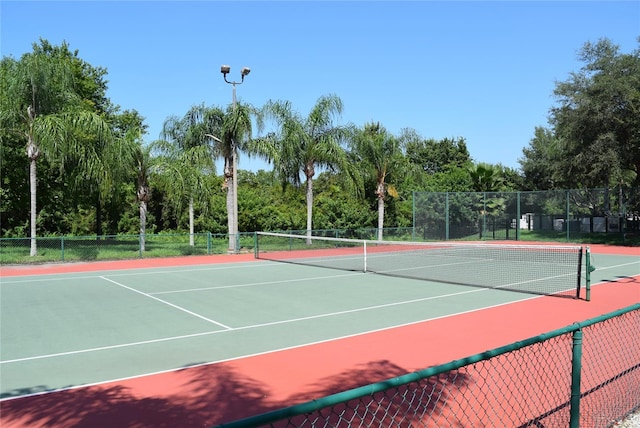 view of sport court with fence