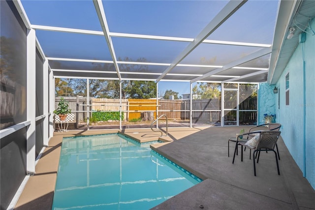 view of pool featuring a patio area, a fenced backyard, a fenced in pool, and a lanai