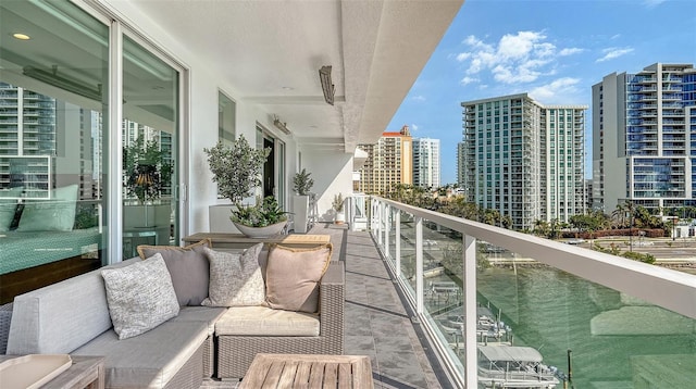 balcony with a city view and outdoor lounge area