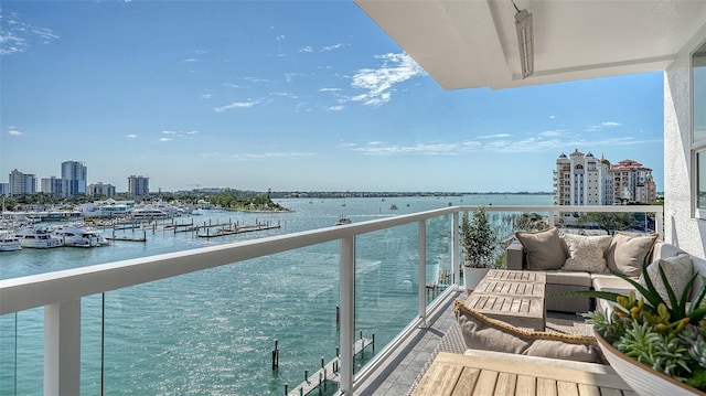 balcony with a view of city and a water view