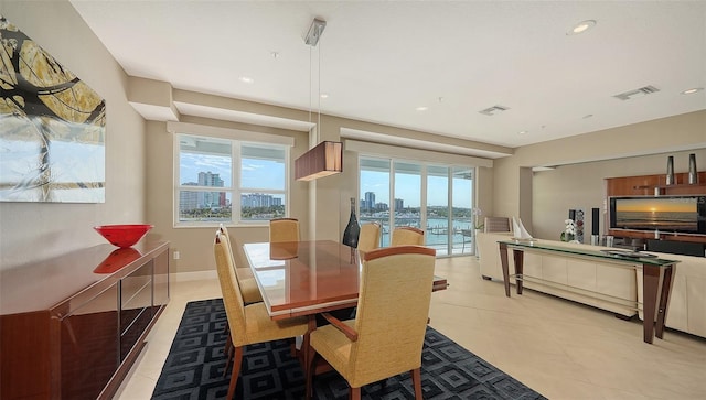 dining area featuring recessed lighting, baseboards, visible vents, and light tile patterned flooring