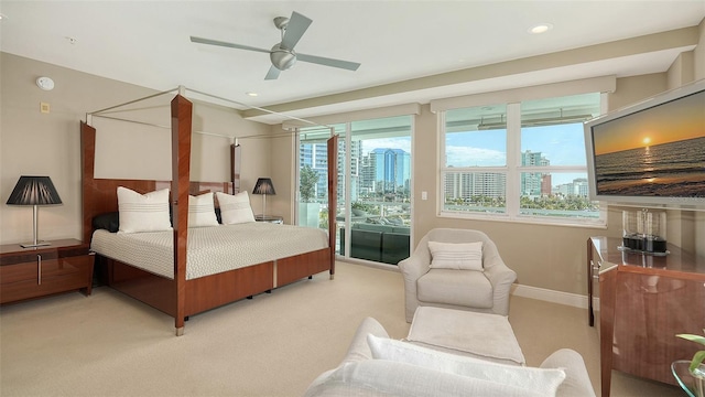 bedroom with baseboards, light carpet, recessed lighting, a ceiling fan, and access to outside