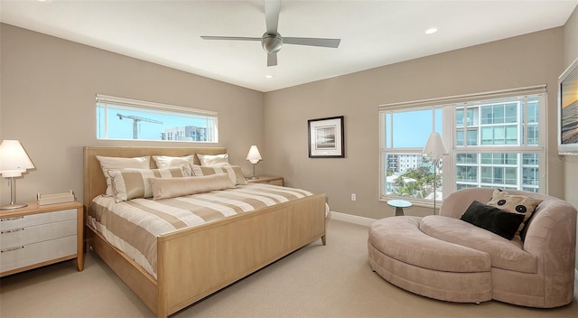 bedroom with multiple windows, recessed lighting, baseboards, and light carpet