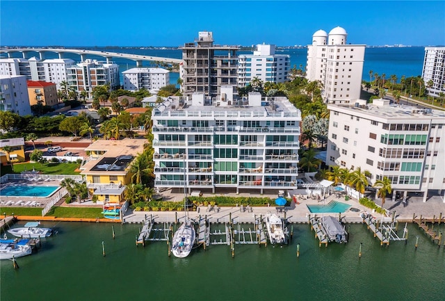 aerial view with a city view and a water view