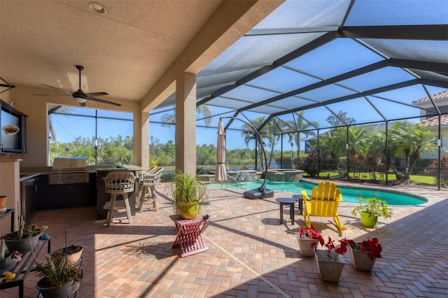 view of patio with glass enclosure, exterior kitchen, a grill, and a pool with connected hot tub