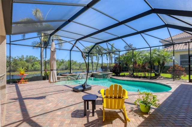 view of swimming pool with a patio area, a lanai, and a pool with connected hot tub