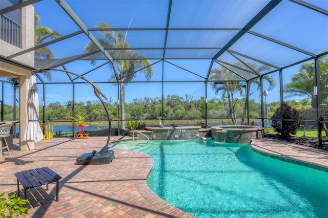 view of pool featuring glass enclosure, a patio area, and a pool with connected hot tub