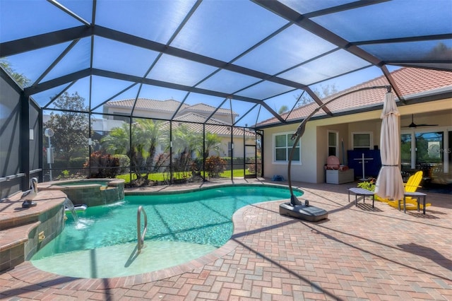 outdoor pool featuring ceiling fan, an in ground hot tub, a patio, and a lanai