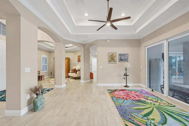 bedroom featuring access to exterior, arched walkways, a raised ceiling, and crown molding