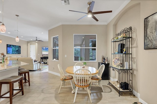 dining room featuring ceiling fan, recessed lighting, visible vents, baseboards, and ornamental molding