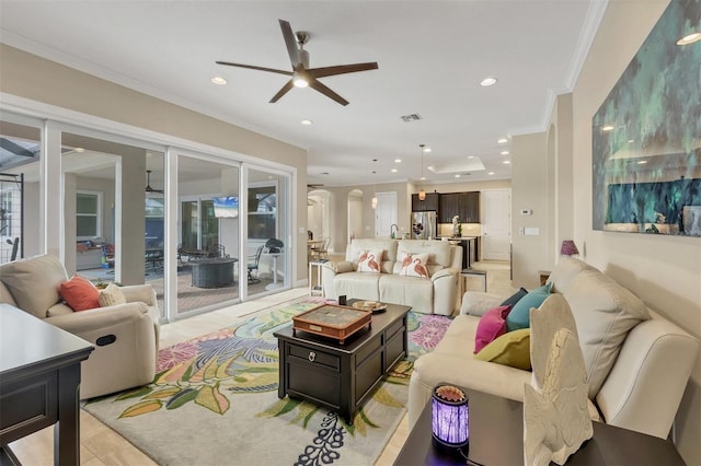 living room featuring arched walkways, recessed lighting, a ceiling fan, visible vents, and crown molding