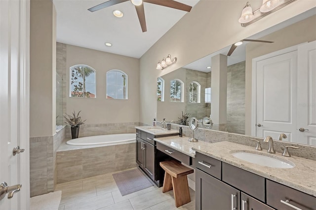 bathroom with a ceiling fan, tiled shower, a sink, tile patterned flooring, and a bath