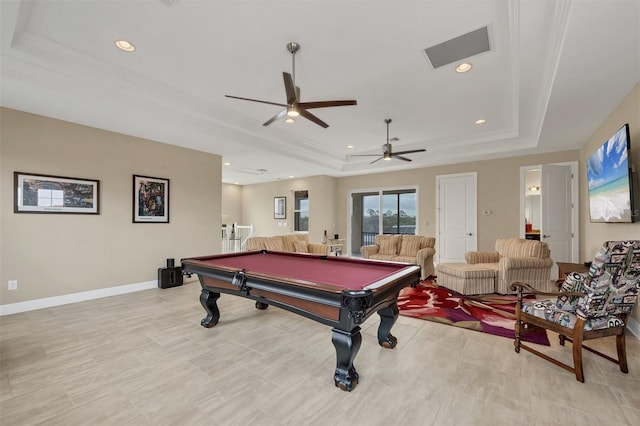 recreation room with a tray ceiling, visible vents, baseboards, and recessed lighting