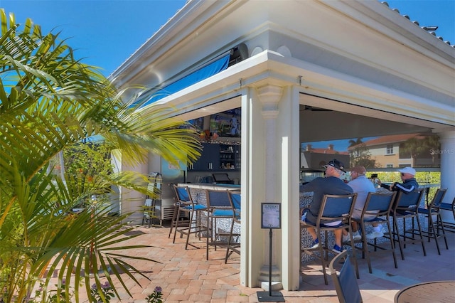 view of patio with outdoor dry bar