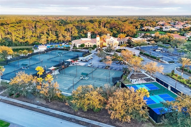 birds eye view of property with a forest view