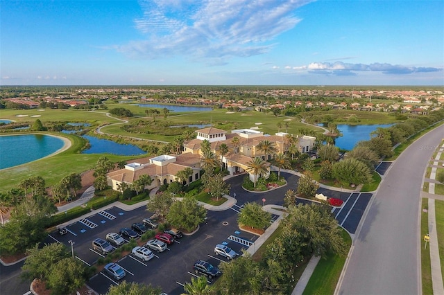 aerial view featuring view of golf course and a water view