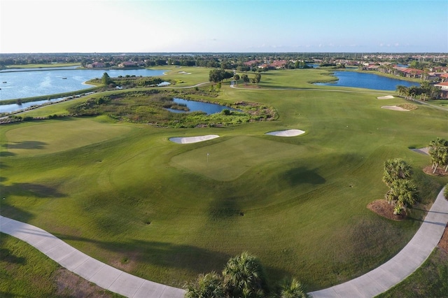 aerial view with a water view and golf course view