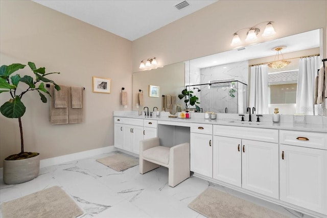 full bathroom featuring marble finish floor, a marble finish shower, visible vents, vanity, and baseboards