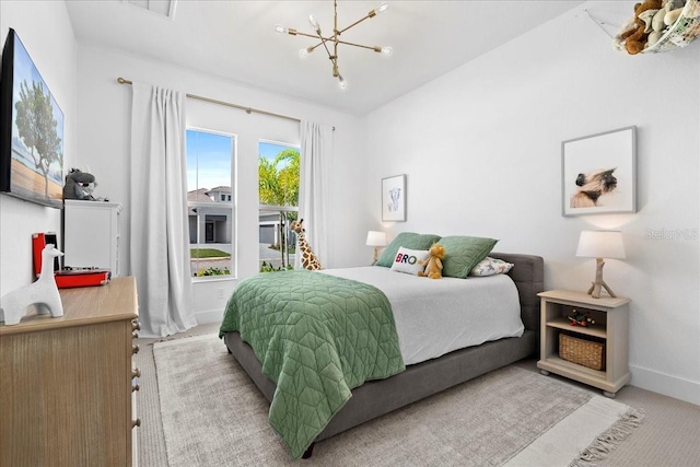 bedroom with light carpet, a notable chandelier, visible vents, and baseboards