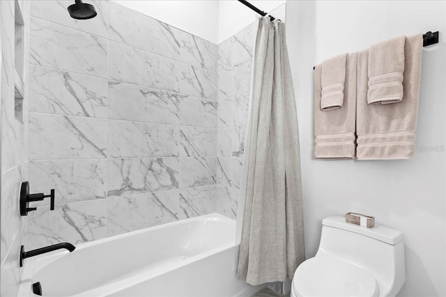 bathroom featuring toilet and shower / bath combo with shower curtain