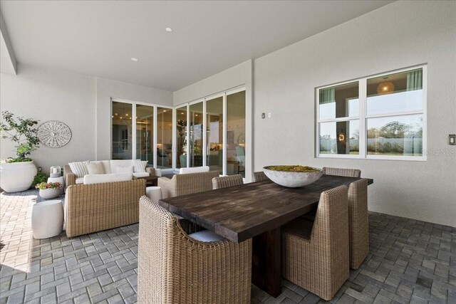 view of patio with outdoor dining area and an outdoor living space