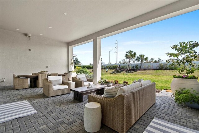 view of patio / terrace featuring fence and an outdoor hangout area