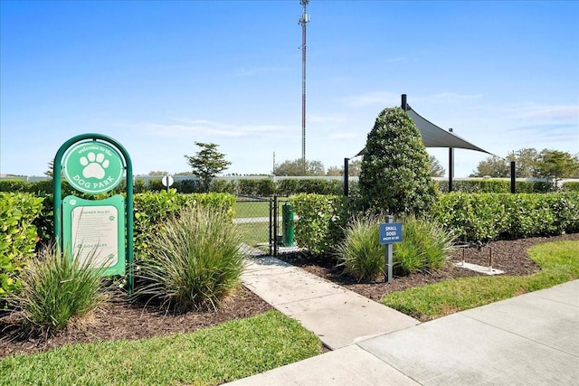 surrounding community with fence and a gate