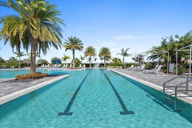 community pool with a patio area