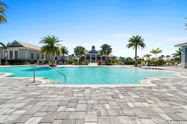 community pool with a patio area