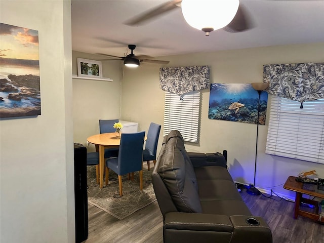 dining space featuring ceiling fan and wood finished floors