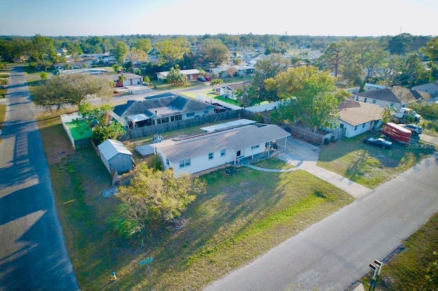 birds eye view of property with a residential view