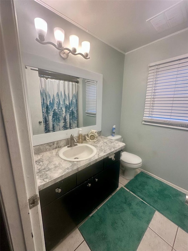 full bathroom featuring crown molding, visible vents, toilet, vanity, and tile patterned flooring