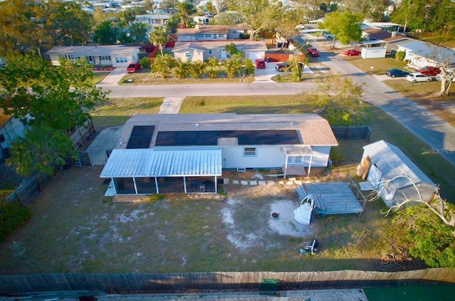 birds eye view of property with a residential view