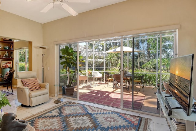 entryway featuring plenty of natural light, a sunroom, ceiling fan, and tile patterned flooring