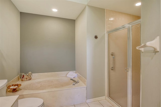 bathroom with tile patterned flooring, a stall shower, toilet, and a garden tub