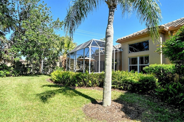 view of yard with a lanai