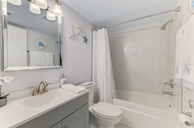 bathroom featuring shower / bath combo, visible vents, vanity, and toilet